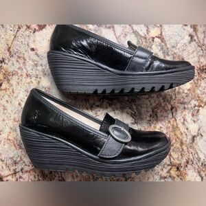 Ladies size 8- black patent leather wedge loafers/ like new